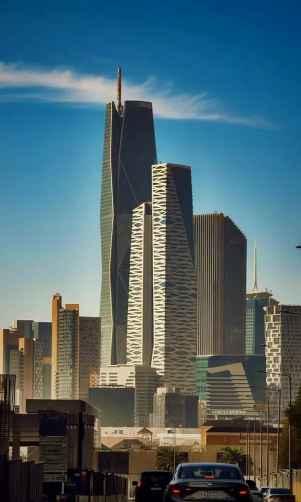 Office towers seen from the road on a clear day.